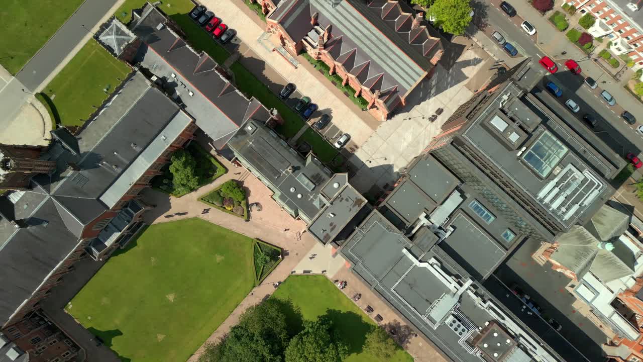 Left-to-right overhead aerial video of Queen's University Belfast, in Northern Ireland, UK on a bright and sunny day. Produced at 4K resolution, 60FPS and with Rec709 color.