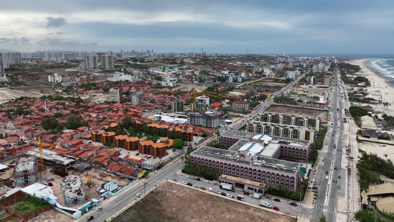 Panoramic aerial view of Fortaleza city under rainy sky, Establishing shot