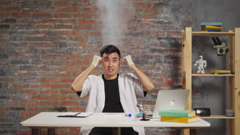 asian scientist with steam above head crazy of experiment