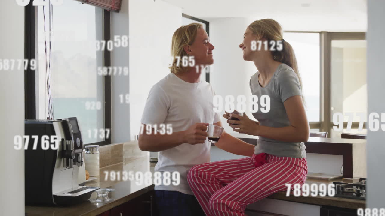 Couple enjoying coffee in kitchen with floating numbers animation overlay