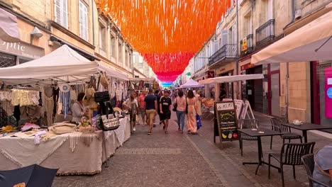 bustling market with colorful decorations and shoppers