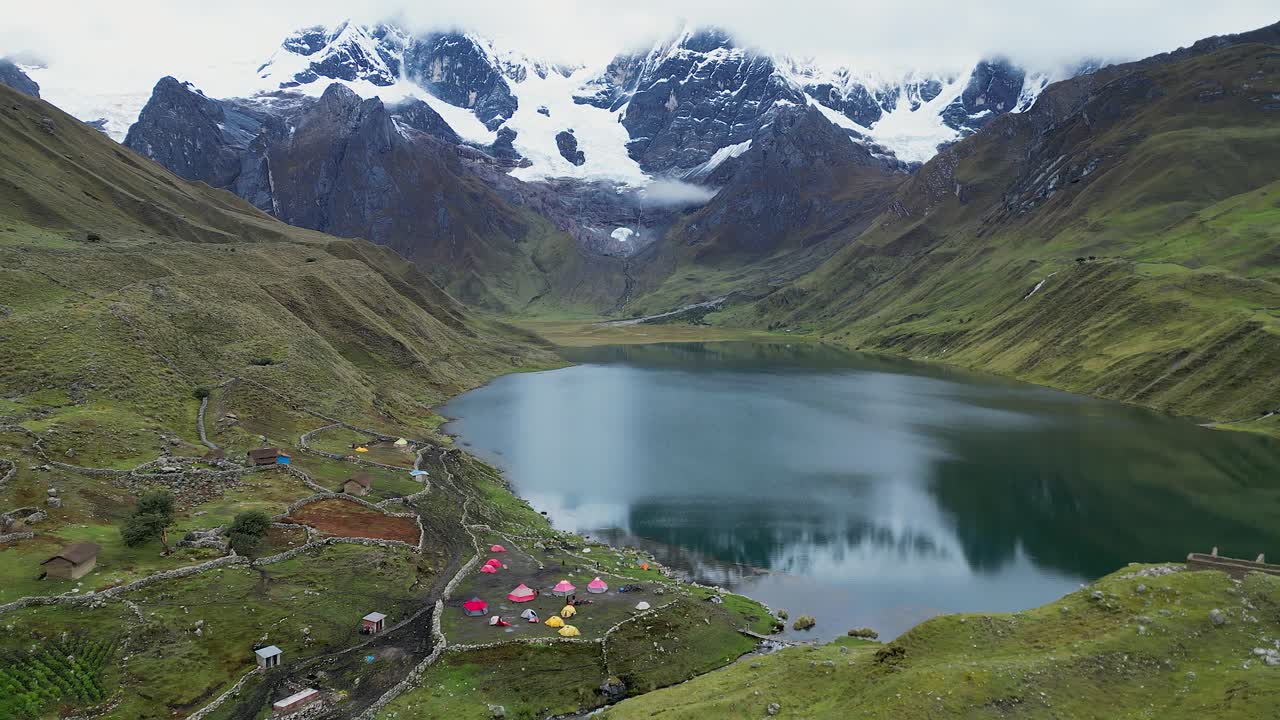 Aerial view of base camp at Laguna Carhuacocha in Peru mountains