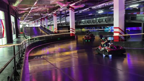 indoor go-karting track with people