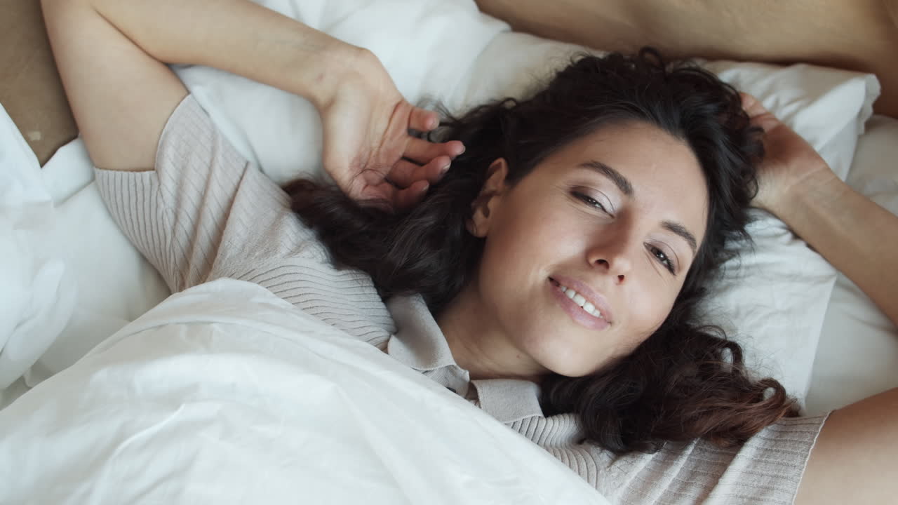 Caucasian Woman Posing Lying in Bed