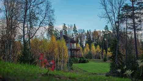 a cottage in the forested countryside in autumn