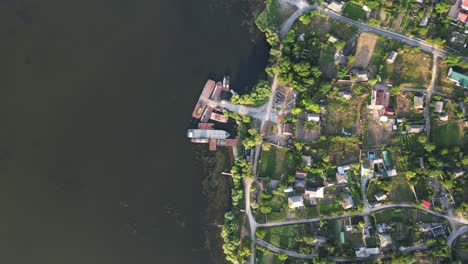 Drone-Journey:-Breathtaking-Aerial-View-Above-Tranquil-Waters-of-Nistru-River-and-Charming-Molovata-Village-with-its-Small-Pier