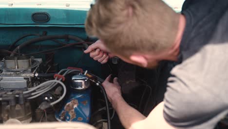 Man-working-on-old-truck