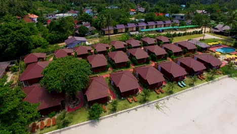 Tilting-the-aerial-drone-shot-to-reveal-the-beachfront-of-Thong-Nai-Pan-Yai-Beach-resort-in-Koh-Phangan-island-in-Thailand