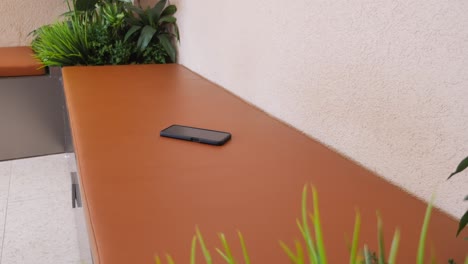 phone on a bench in a waiting area