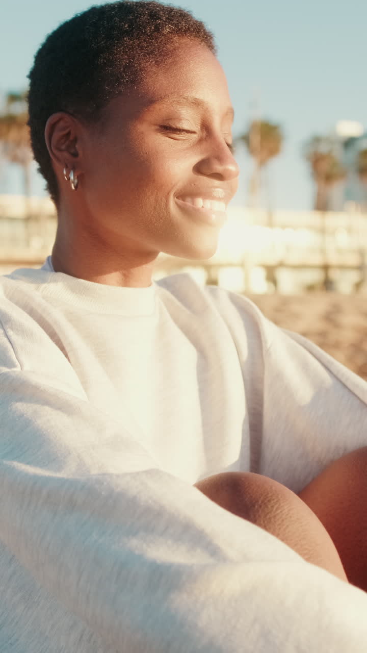 Happy Young African American Woman Smiling in Golden Sunlight Outdoors