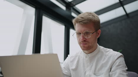 customer service department in it-company adult man is typing message in online chat for answer