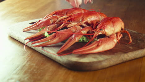 delicious red crayfish on a wooden board with salad