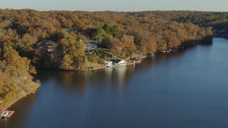 Aerial-descent-upon-lake-front-boat-house