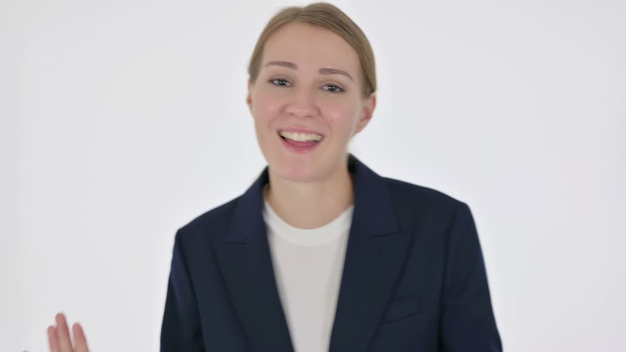 Young Businesswoman Dancing in Joy on White Background