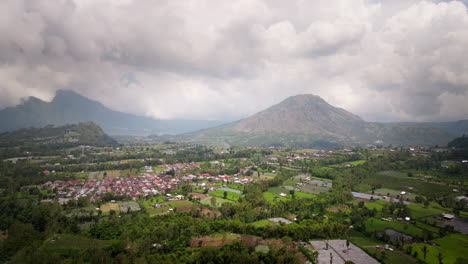 farming village near mount batur on misty morning in bali, indonesia