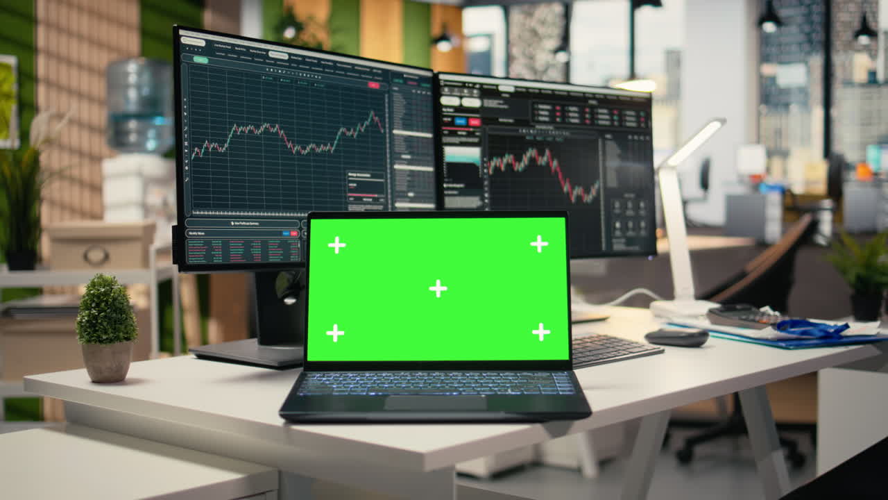 Close up of trading software in forex office with graphs on green screen laptop