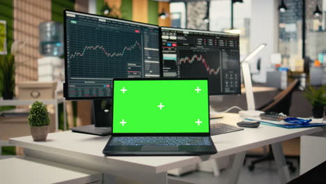 close up of trading software in forex office with graphs on green screen laptop