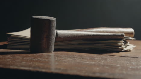 wooden mallet on documents