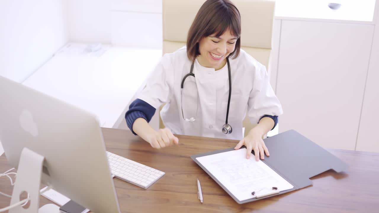 Doctor communicating good results to a patient over the phone