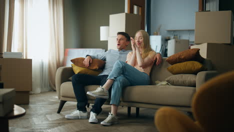 man gifting keys woman from new home. happy couple enjoying moving in apartment.