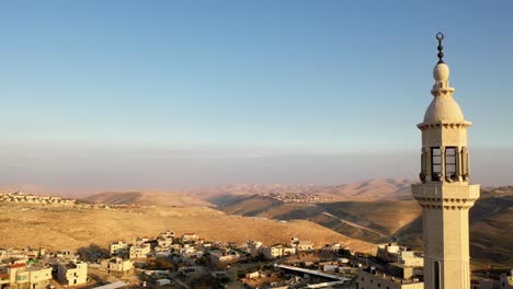 mosque tower minaret in palestine town, aerial view