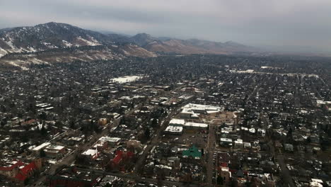 Christmas-in-Boulder-Colorado-Pearl-Street-Mall-Baseline-aerial-drone-cinematic-December-University-of-Colorado-Rocky-Mountain-National-Park-Estes-Park-Winter-cloudy-cars-buildings-streets-forward