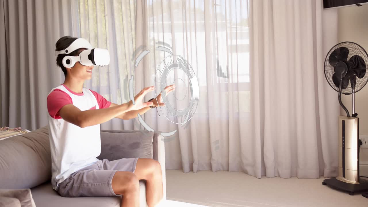 Teen male on home sofa raising hand, sweeping pinching, causing holo HUD analyzing DNA for edtech