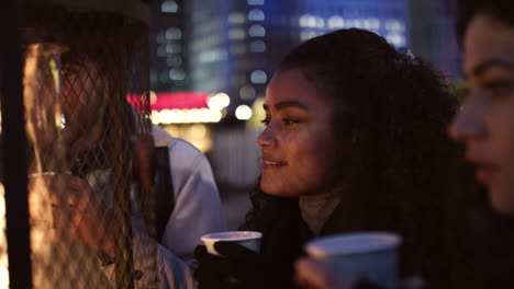 friends drinking mulled wine at christmas market