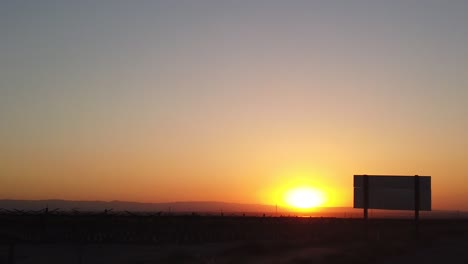 driving to los angeles with a sunset in the distance