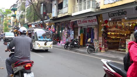 vehicles and pedestrians in a lively urban scene