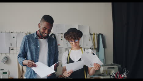 fashion designers reviewing patterns