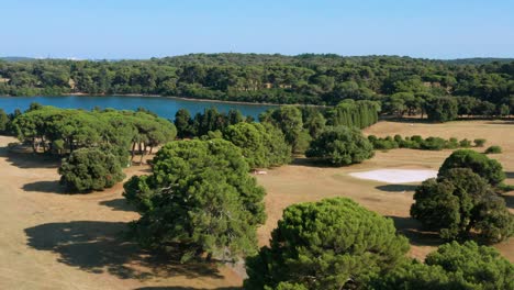 Aerial-pan-shot-over-the-island-of-Brijuni,-Croatia-on-a-bright-clear-day