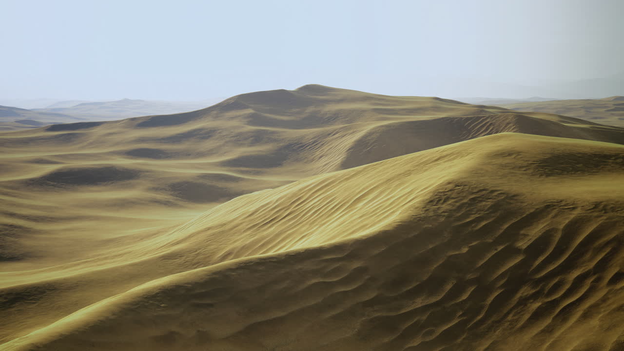 Expansive golden sand dunes stretch under the bright sky at midday