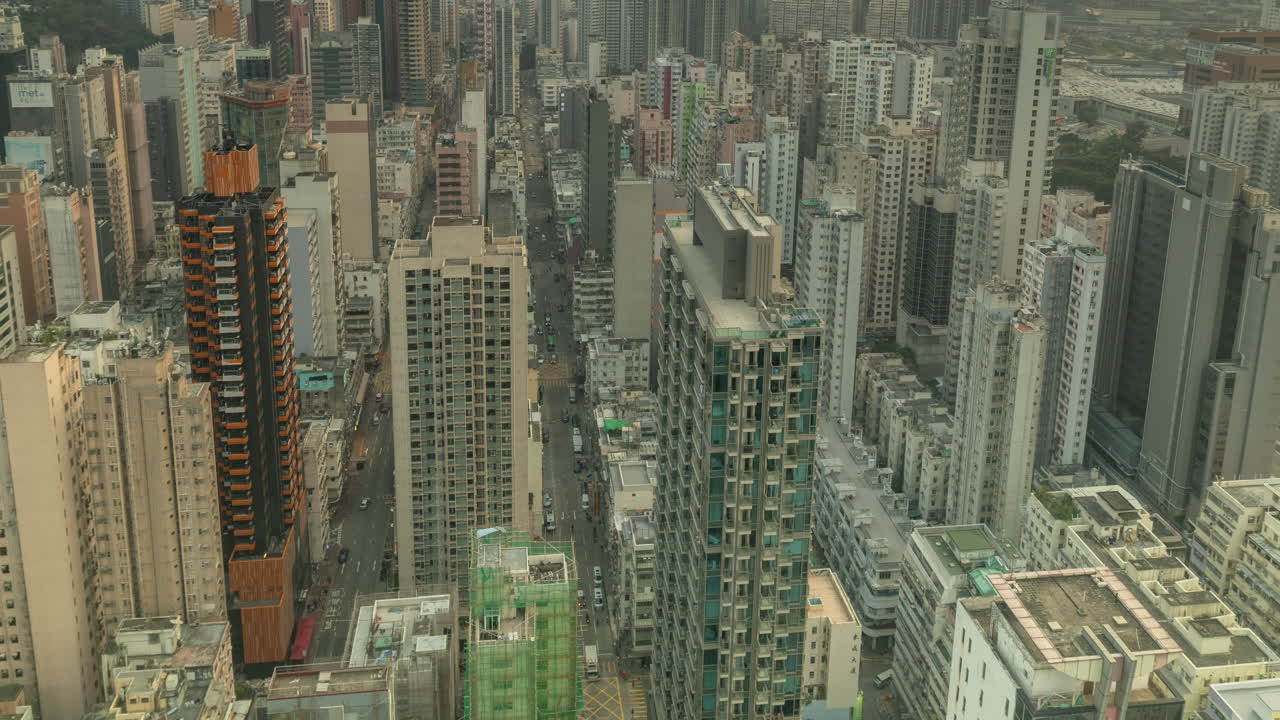 HONG KONG - 19 MARCH 2025 : Timelapse of the Hong Kong kowloon skyline from a high vantage point