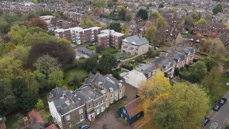 residential areas in ealing, featuring a mix of period homes and purpose-built properties set amidst green spaces, creating a peaceful neighborhood atmosphere
