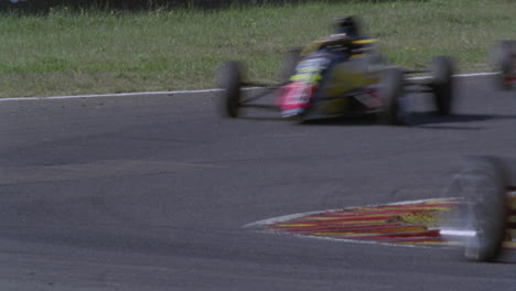 formula cars compete on a circuit track 3