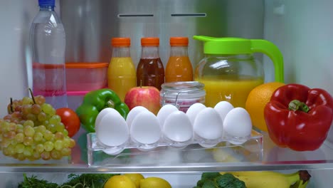 Open-refrigerator-filled-with-food