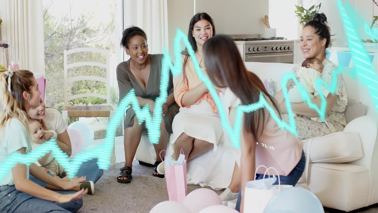 Central woman unwrapping gift at baby party, guests clapping, turquoise ECG sweeping over group