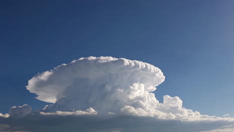 a majestic cumulonimbus cloud against a blue sky