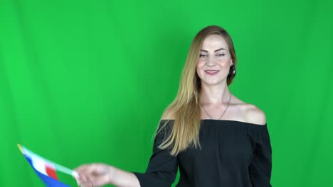 young blonde woman waving in front of france flag green screen, chroma key background - france flag stock video clip footage