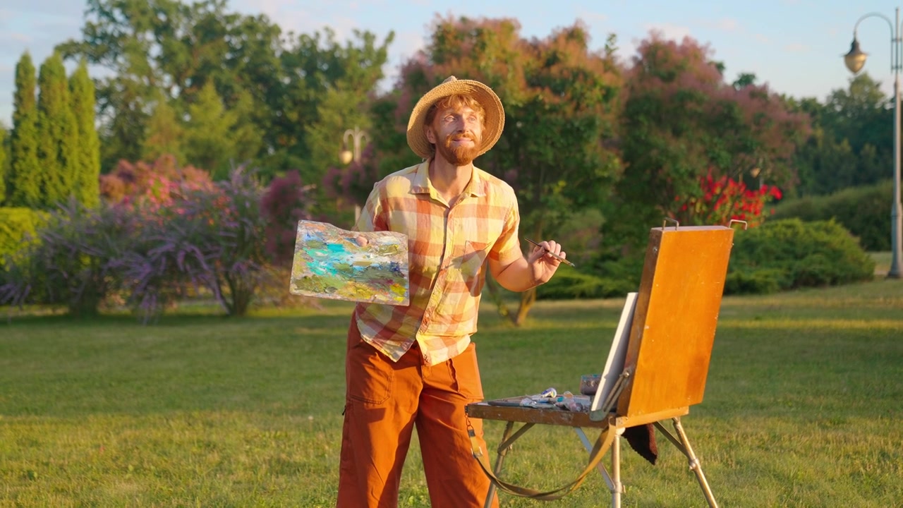 Inspired Artist Painting a Landscape on an Easel in Nature