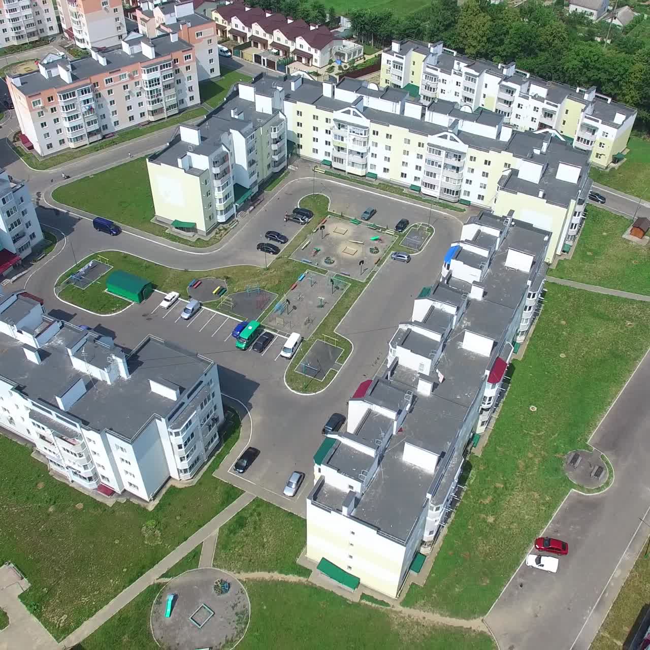 modern buildings with infrastructure in aerial view. Quarter with high-rise buildings is on a green lawn background