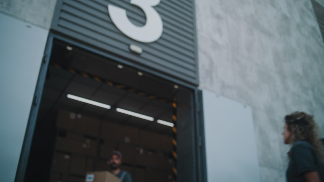 Delivery Man Working in a Warehouse Setting