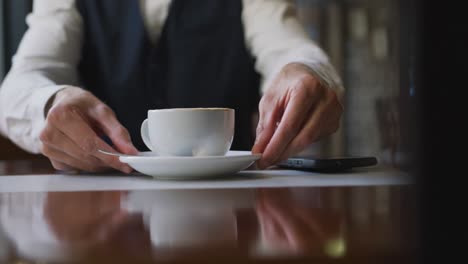 young professional man in a cafe