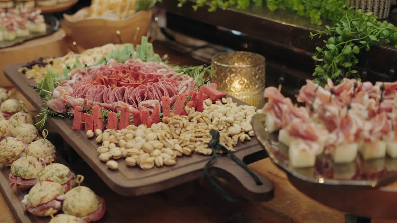 wedding table with artisanal charcuterie meats, cheeses and nut selection