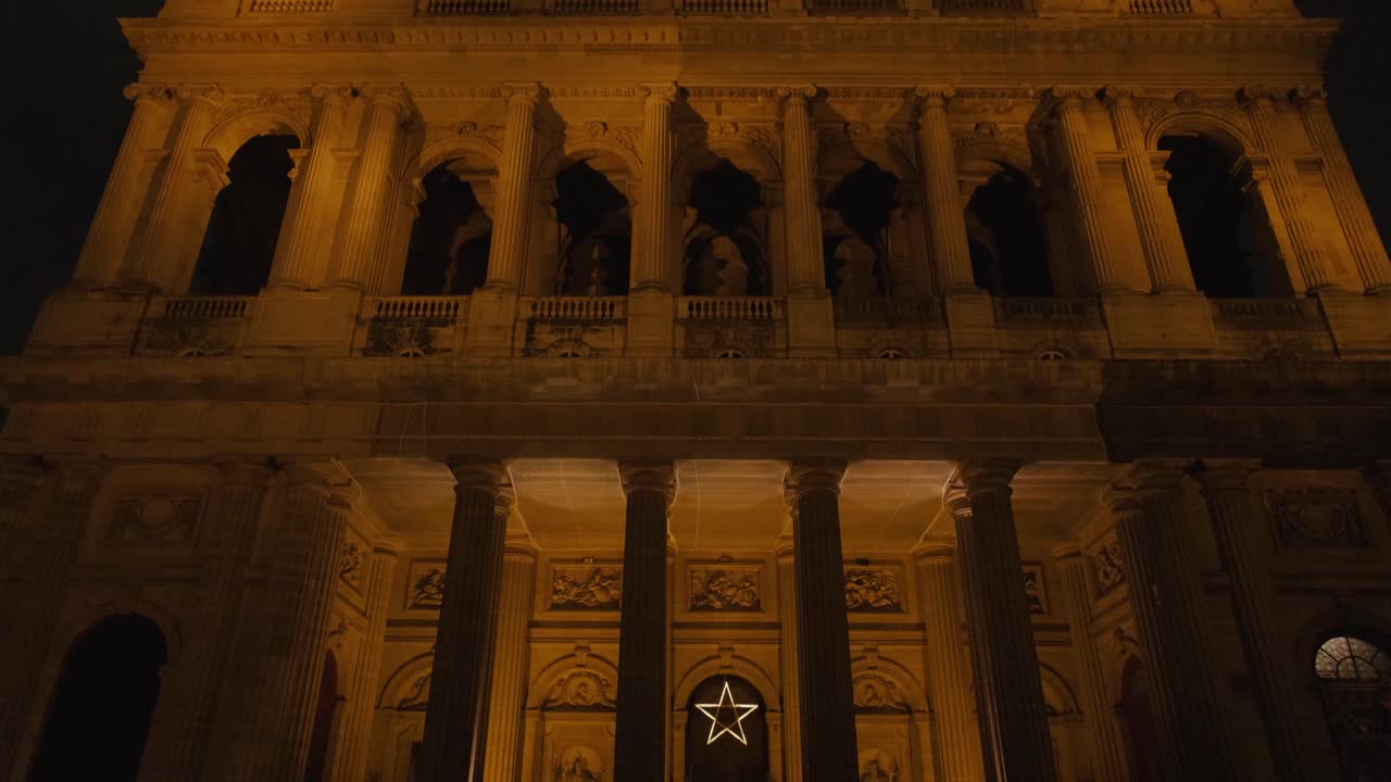 Beautiful Pan Shot of Saint-Sulpice Church Facade Illuminated at Night in Paris