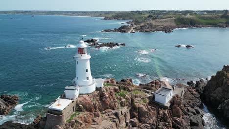 Lighthouse-panning-drone-aerial-La-Corbière,-Jersey