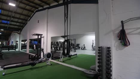 promotional shot in gym of various fitness equipment and gym floor