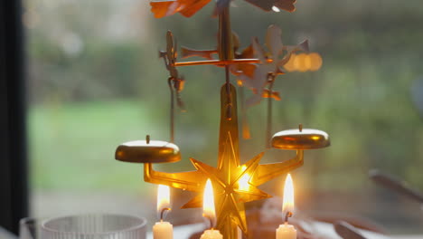 traditional christmas carousel with glowing candles and spinning angels