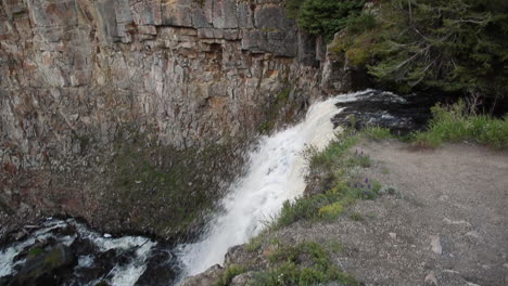 mystic falls waterfall in yellowstone national park panning to river